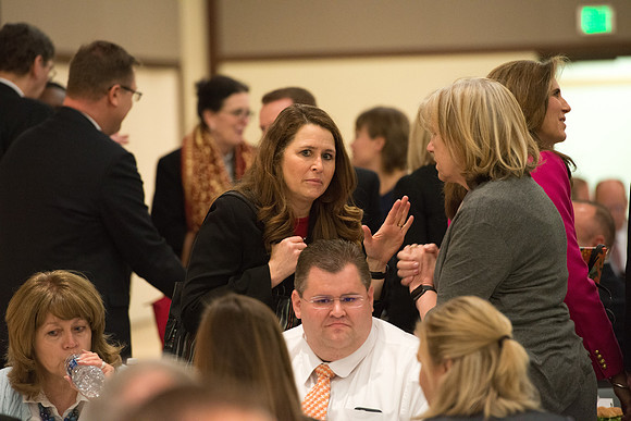 Faculty gather at a luncheon to be taught by Clayton Christensen, the "Kim B. Clark Professor" of Business Administration at the Harvard Business School.