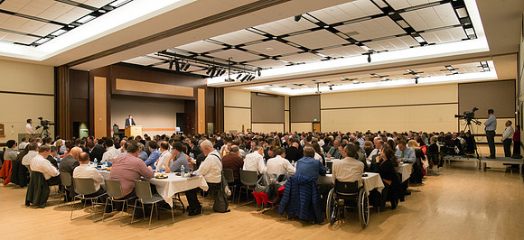 Faculty gather at a luncheon to be taught by Clayton Christensen, the "Kim B. Clark Professor" of Business Administration at the Harvard Business School.