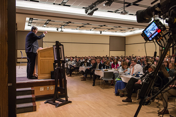 Faculty gather at a luncheon to be taught by Clayton Christensen, the "Kim B. Clark Professor" of Business Administration at the Harvard Business School.