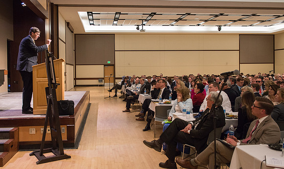 Faculty gather at a luncheon to be taught by Clayton Christensen, the "Kim B. Clark Professor" of Business Administration at the Harvard Business School.