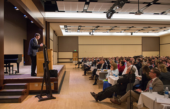 Faculty gather at a luncheon to be taught by Clayton Christensen, the "Kim B. Clark Professor" of Business Administration at the Harvard Business School.