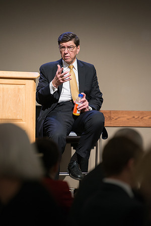 Faculty gather at a luncheon to be taught by Clayton Christensen, the "Kim B. Clark Professor" of Business Administration at the Harvard Business School.