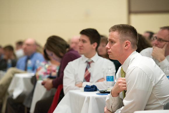 Faculty gather at a luncheon to be taught by Clayton Christensen, the "Kim B. Clark Professor" of Business Administration at the Harvard Business School.