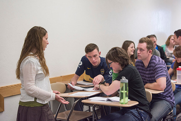 A student in Sister Christensen's Essentials of Human Nutrition asks a question about the group assignment that was worked on in class.