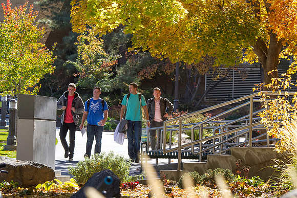 A group of students walk through campus during the 2014 Fall Semester.