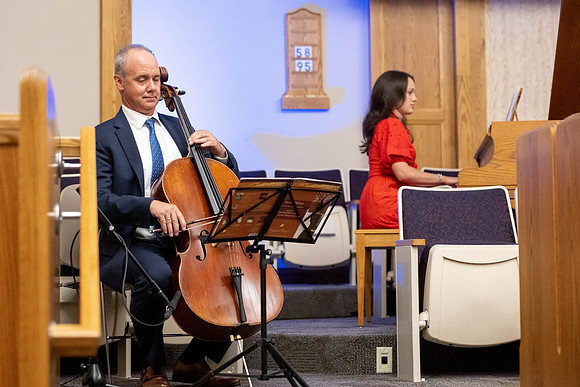 A cellist and pianist perform during devotional.