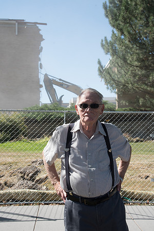 Darwin Wolford in front of the demolition of the Kirkham Building.