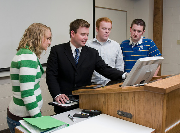 Business Management students Trent Nielsen, Alex Clark, & Hailey Gochnour with instructor Jason Earl.