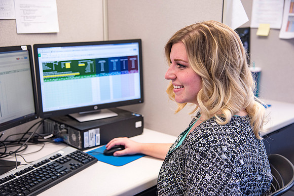 Employees work on developing a better curriculum for online students.