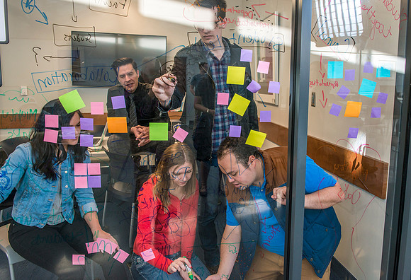 Students in the Science & Tecnology Center collaberate on a project for the "Mighty Oaks Council".