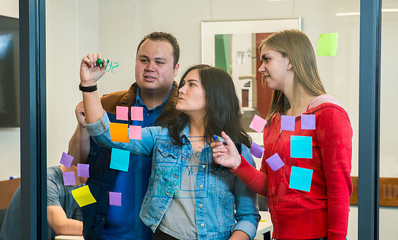 Students in the Science & Tecnology Center collaberate on a project for the "Mighty Oaks Council".