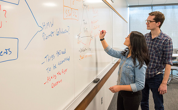 Students in the Science & Tecnology Center collaberate on a project for the "Mighty Oaks Council".