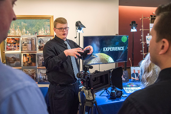 Communications majors ready to graduate display their senior projects.