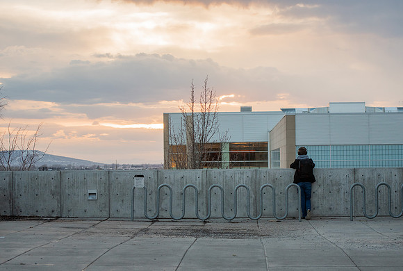BYUI Student watches the sunset in the winter.