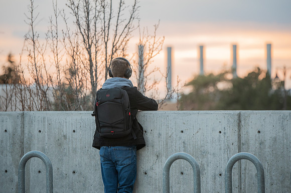 BYUI Student watches the sunset in the winter.