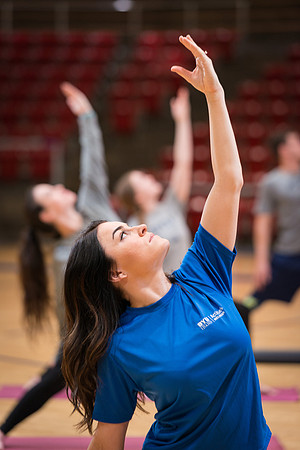 Students participate in Yoga in the Hart Auditorium.