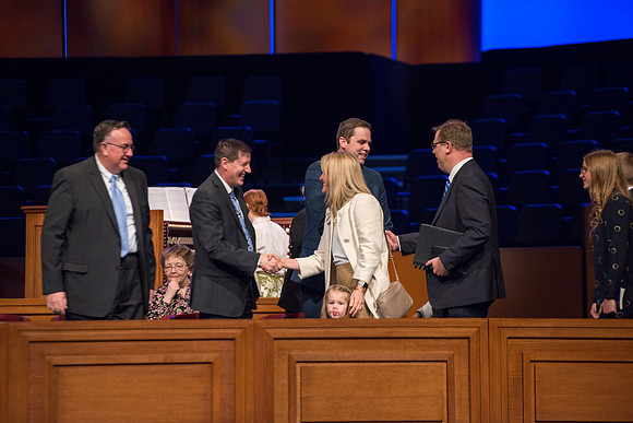 Gilberts are greeted as they enter for their last devotional.