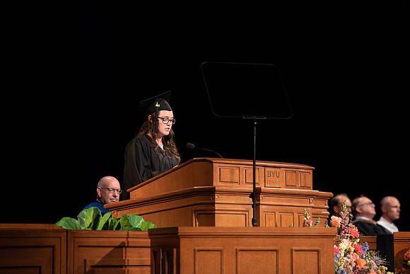 Students partipate in walking to graduate from the College of Business and Communication.