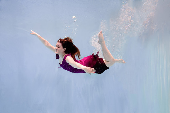 Dance students try posing underwater in the Hart pool.