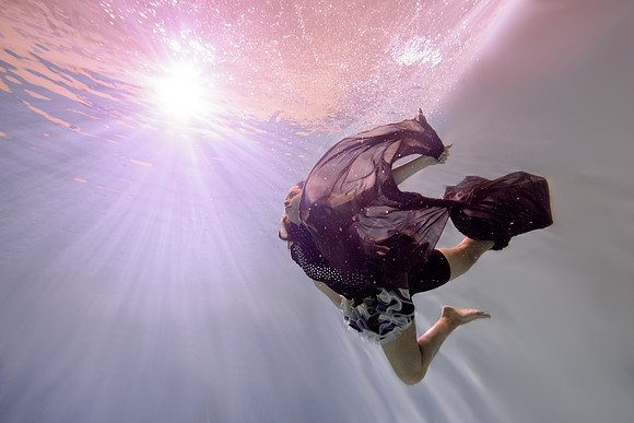 Dance students try posing underwater in the Hart pool.