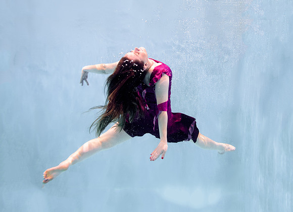Dance students try posing underwater in the Hart pool.