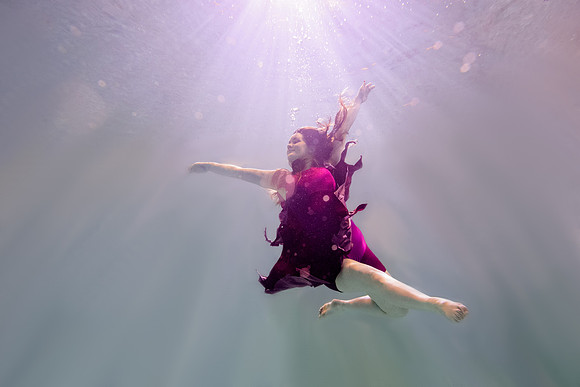 Dance students try posing underwater in the Hart pool.
