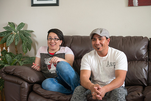Pathway student, Marcela Avila in her home with her husband.
