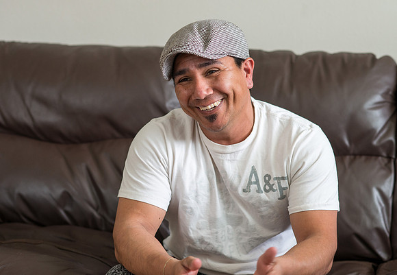 Pathway student, Marcela Avila in her home with her husband.