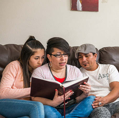 Pathway student, Marcela Avila in her home with her husband and three kids.