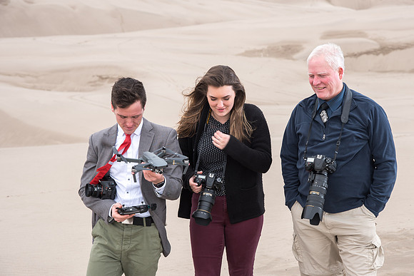 University Relations Photographers, Mike Lewis, Ryan Chase, Courtney Thomas. take Field trip to the sand dunes for a change of scenery and to get a group photo.