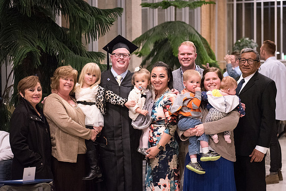 Graduates gather with family and friends.
