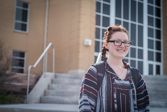 Ashley Call stands in front of the Hinkley Buidling. 2017