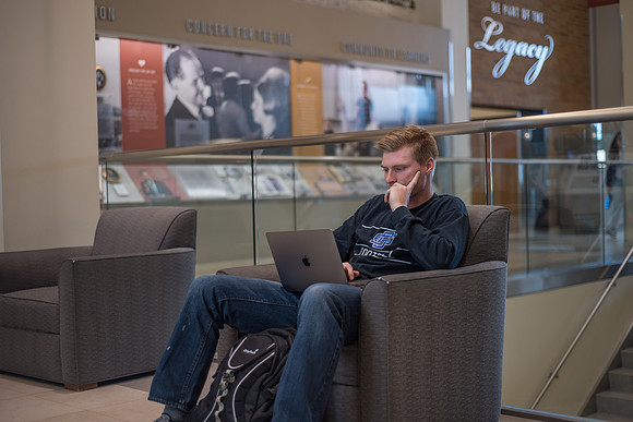A student studies in the Hyrum Manwaring Center. 2017
