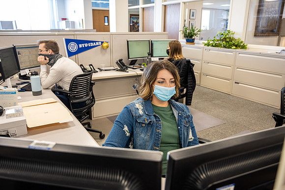 Student employees in the Admissions office wearing mask due to COVID-19 pandemic.