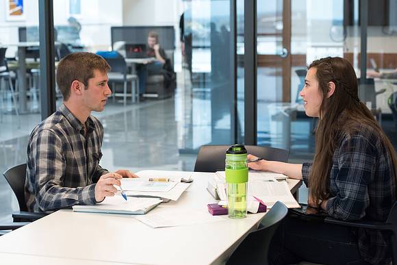 Students get back to school and begin their studies in the Science and Technology Building.
