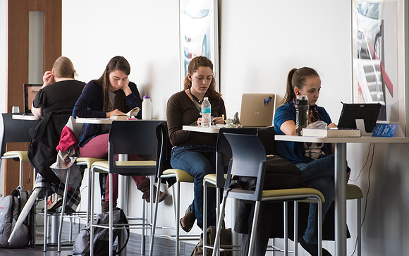 Students get back to school and begin their studies in the Science and Technology Building.