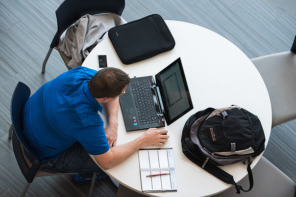 Students get back to school and begin their studies in the Science and Technology Building.