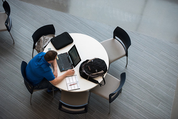 Students get back to school and begin their studies in the Science and Technology Building.