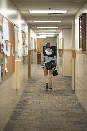 Taylor Williams walks in the Benson Building. 2017