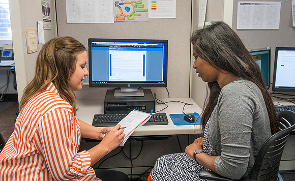 Student employees working together in Course Improvement.