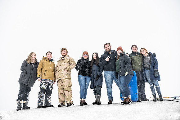 An Home evening group goes sledding.