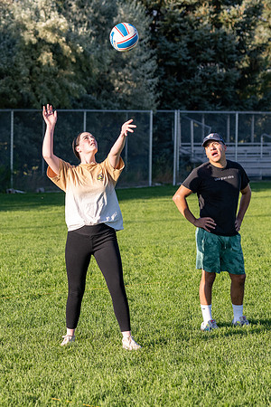 Students gather to play volleyball.