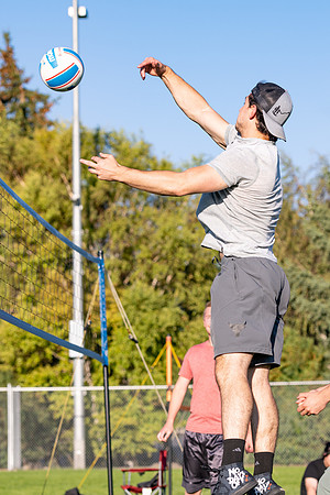 Students gather to play volleyball.