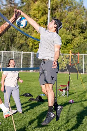 Students gather to play volleyball.