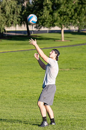 Students gather to play volleyball.