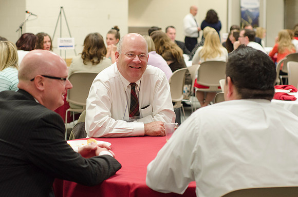 Online instructors gather for breakfast and instruction.