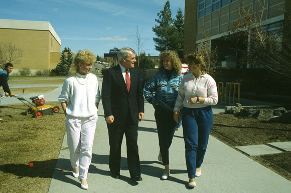 Christensen, pictured with several students, always encouraged spiritual development and high moral values. President of Ricks College from 1985-1989.
