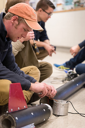 The Rocket Team from the Mechanical Engineering Department gather together to prepare for their rocket launch.