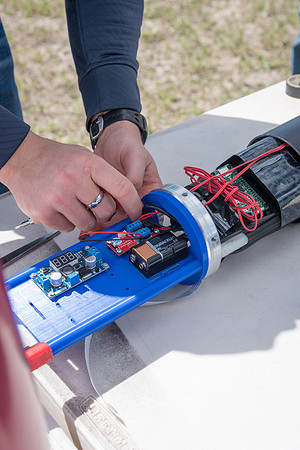 The Rocket Team from the Mechanical Engineering Department gather together to prepare for their rocket launch.