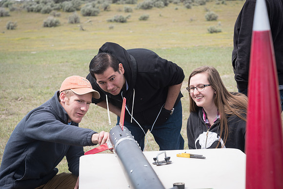 The Rocket Team from the Mechanical Engineering Department gather together to prepare for their rocket launch.